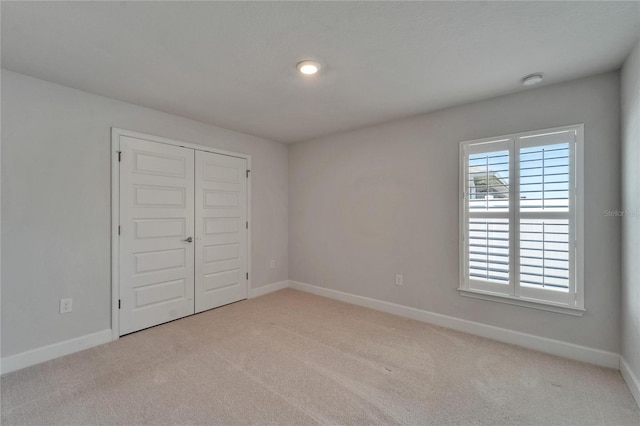 5419 Knights Landing Dr, Lakeland, FL 33810 - unfurnished bedroom featuring a closet, baseboards, and carpet