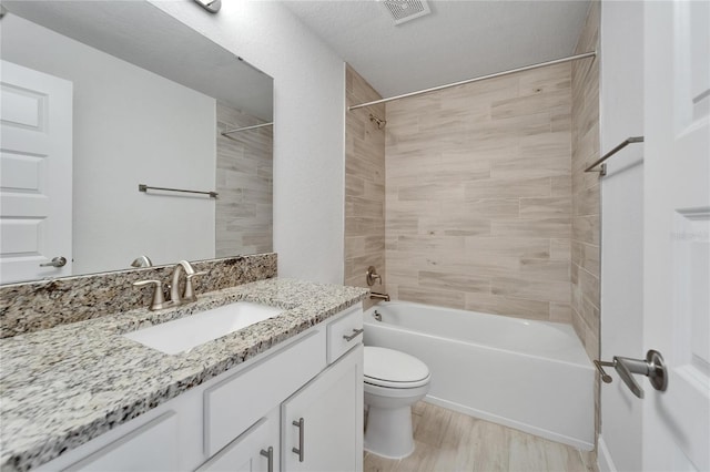 5419 Knights Landing Dr, Lakeland, FL 33810 - bathroom with vanity, shower / bath combination, toilet, visible vents, and wood finished floors