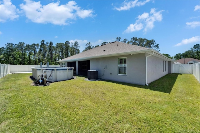 5419 Knights Landing Dr, Lakeland, FL 33810 - rear view of property featuring a fenced in pool, stucco siding, central AC unit, a fenced backyard, and a yard