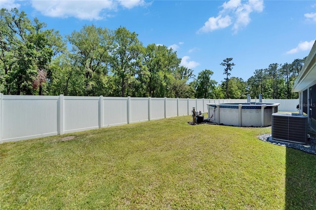 5419 Knights Landing Dr, Lakeland, FL 33810 - view of yard featuring central AC, a fenced backyard, and a fenced in pool