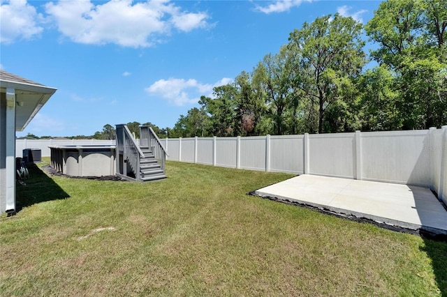 5419 Knights Landing Dr, Lakeland, FL 33810 - view of yard featuring a patio, a fenced backyard, and a fenced in pool