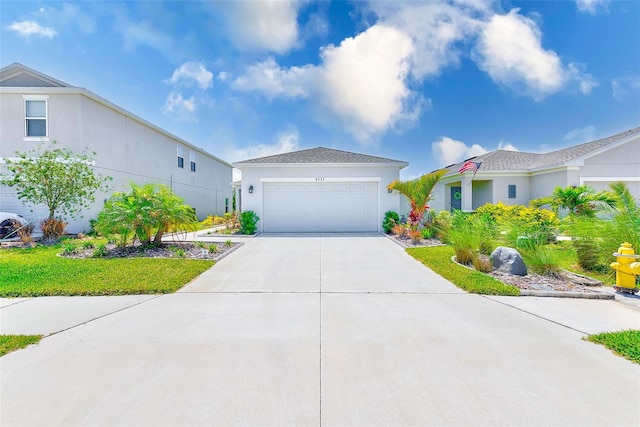 6333 Milestone Loop, Palmetto, FL 34221 - ranch-style house with a garage, stucco siding, and concrete driveway