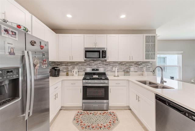 6333 Milestone Loop, Palmetto, FL 34221 - kitchen featuring light countertops, tasteful backsplash, appliances with stainless steel finishes, and a sink