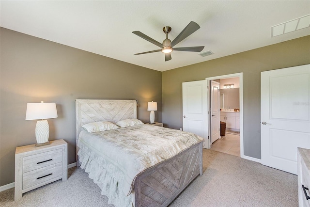 6333 Milestone Loop, Palmetto, FL 34221 - bedroom with ensuite bath, baseboards, visible vents, and light colored carpet