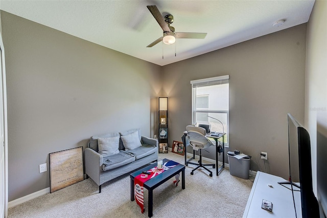 6333 Milestone Loop, Palmetto, FL 34221 - living area featuring light carpet, a ceiling fan, and baseboards