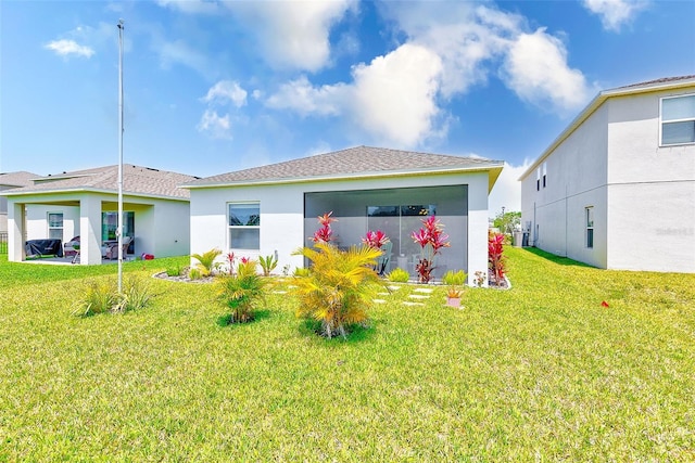 6333 Milestone Loop, Palmetto, FL 34221 - back of house featuring a lawn, central AC unit, stucco siding, and roof with shingles