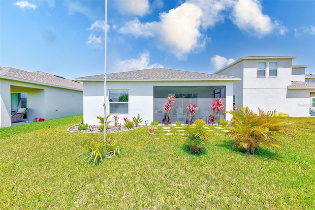 6333 Milestone Loop, Palmetto, FL 34221 - rear view of property featuring stucco siding, a yard, and a shingled roof