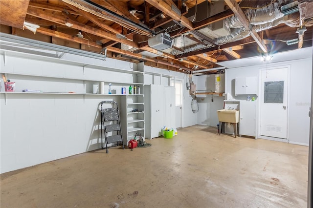 basement featuring a garage and a sink