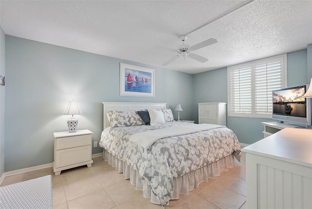 6322 Palma Del Mar Blvd S Unit 706, Saint Petersburg, FL 33715 - bedroom with light tile patterned floors, baseboards, a ceiling fan, and a textured ceiling