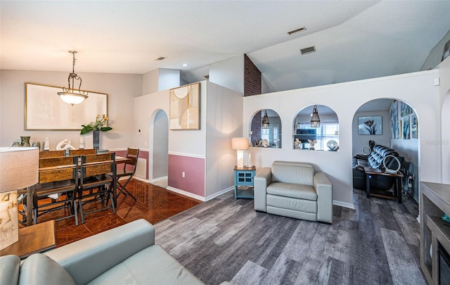 living room with baseboards, arched walkways, and lofted ceiling