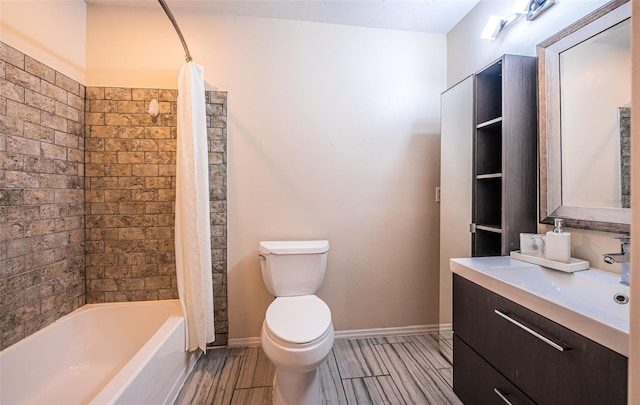 bathroom featuring vanity, baseboards, wood finish floors, shower / bath combo, and toilet