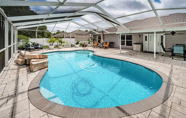 view of swimming pool with a patio area, outdoor dining space, and fence