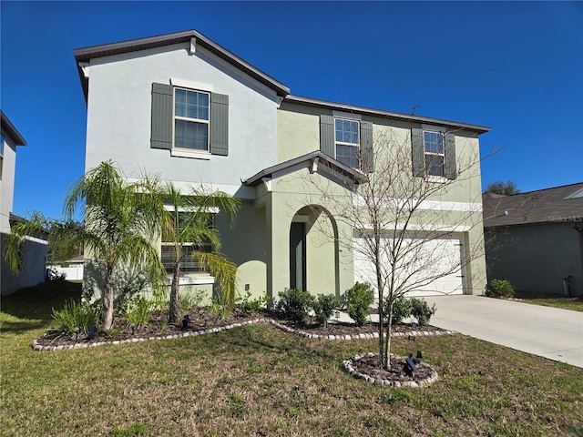 traditional-style home with a garage, driveway, stucco siding, and a front lawn