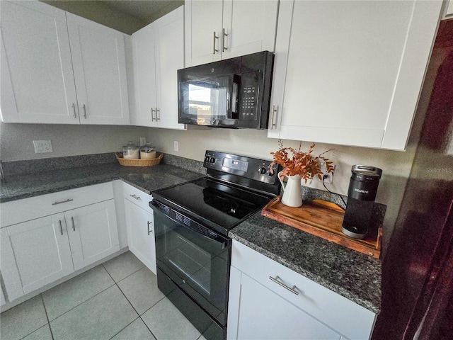 kitchen with dark stone countertops, light tile patterned floors, white cabinets, and black appliances