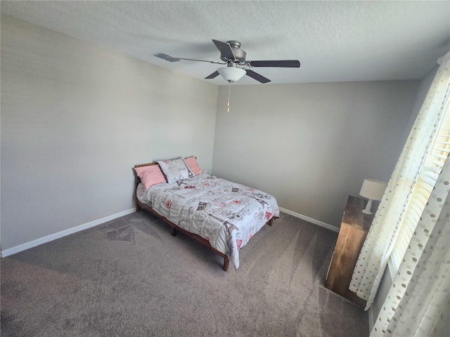 carpeted bedroom featuring visible vents, ceiling fan, baseboards, and a textured ceiling