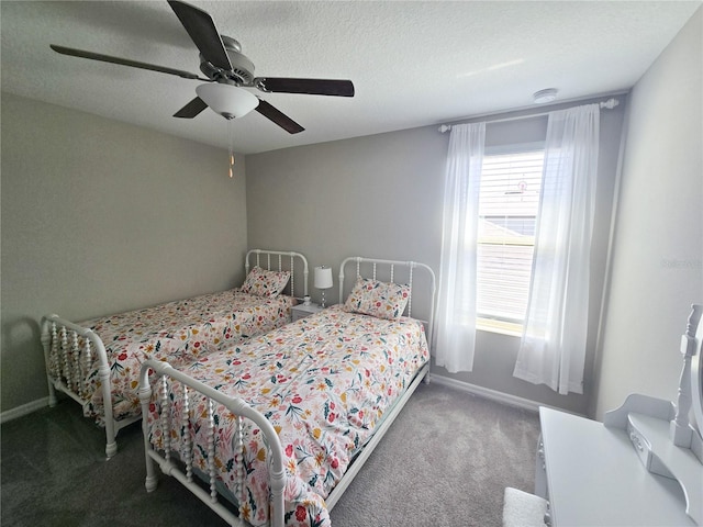 bedroom featuring a textured ceiling, ceiling fan, baseboards, and carpet
