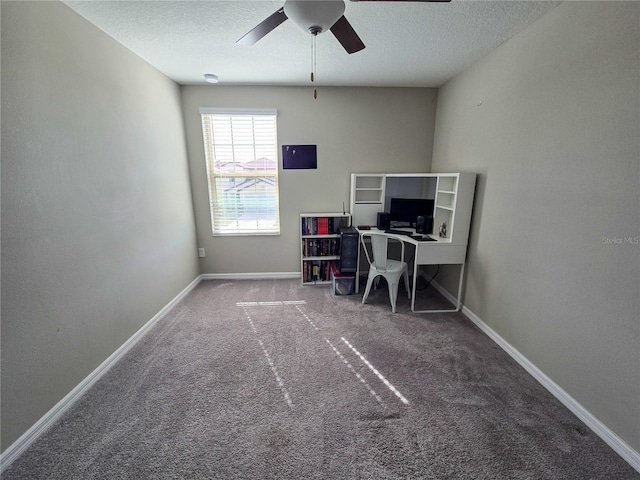office featuring carpet floors, ceiling fan, baseboards, and a textured ceiling