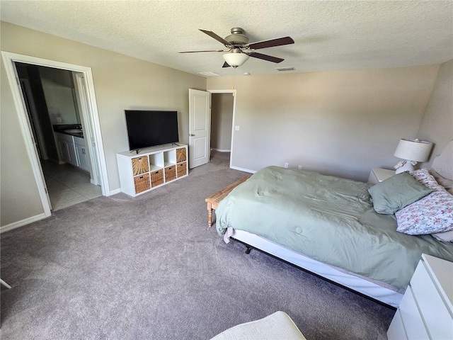 carpeted bedroom featuring baseboards, a textured ceiling, and ceiling fan