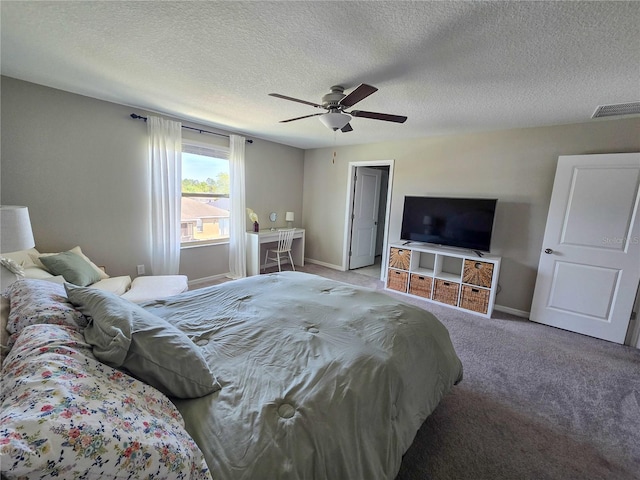 bedroom with visible vents, baseboards, ceiling fan, carpet, and a textured ceiling