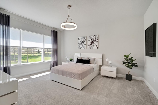 carpeted bedroom with baseboards