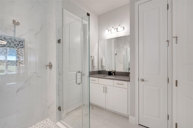 full bathroom featuring vanity, marble finish floor, and a marble finish shower