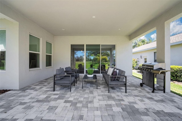 view of patio featuring a grill and an outdoor hangout area