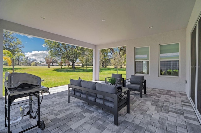 view of patio featuring outdoor lounge area and a grill