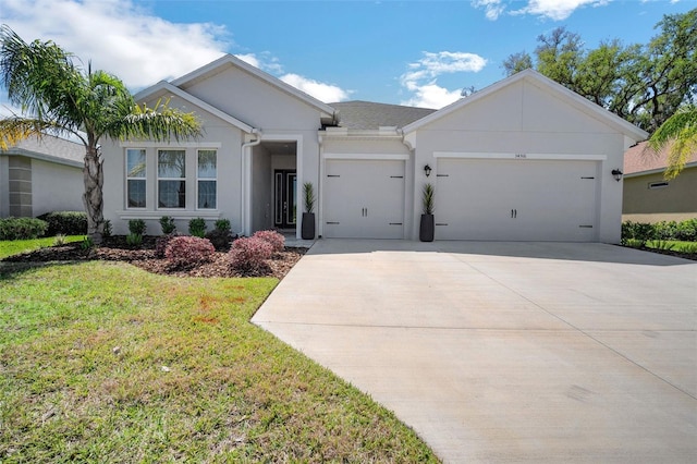 ranch-style house featuring an attached garage, a front lawn, driveway, and stucco siding