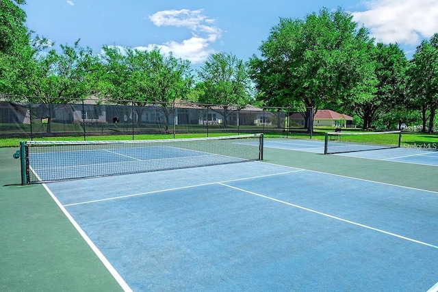 view of sport court with fence