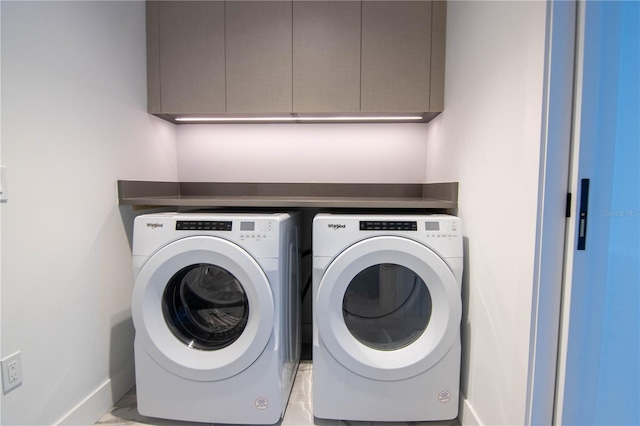 777 3rd Ave N Unit 1501, Saint Petersburg, FL 33701 - washroom featuring washing machine and dryer, cabinet space, and baseboards