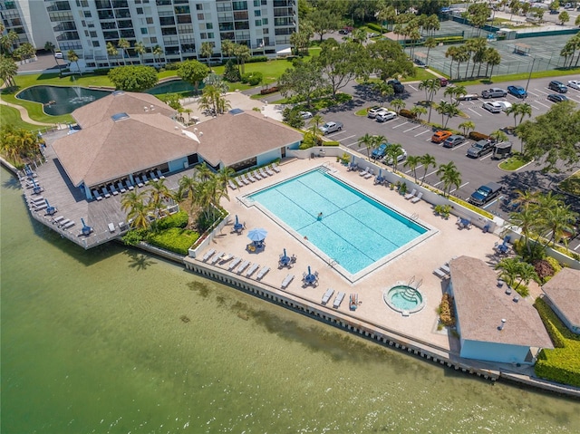 9495 Blind Pass Rd Unit 308, St Pete Beach, FL 33706 - aerial view of a pool, apartment complex / building, and a large body of water