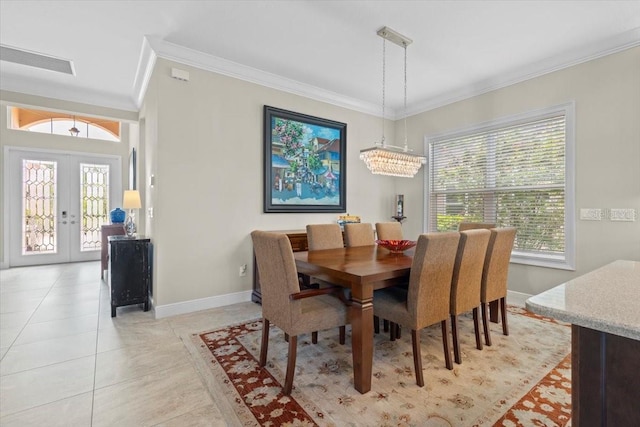 dining room featuring crown molding, light tile patterned floors, visible vents, french doors, and baseboards
