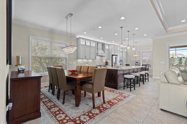 dining room with recessed lighting, light tile patterned floors, baseboards, and crown molding