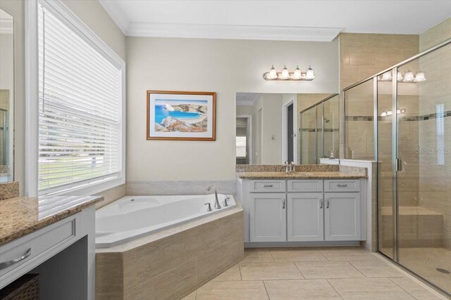 full bath featuring ornamental molding, a shower stall, vanity, and a garden tub