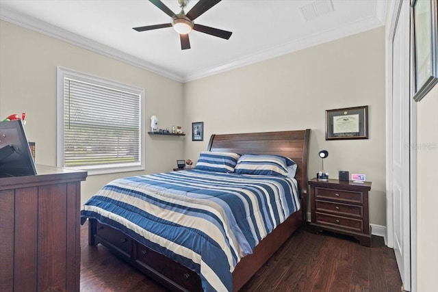 bedroom with crown molding, ceiling fan, visible vents, wood finished floors, and baseboards