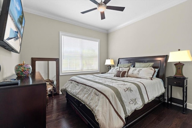 bedroom with dark wood-type flooring, ceiling fan, and crown molding