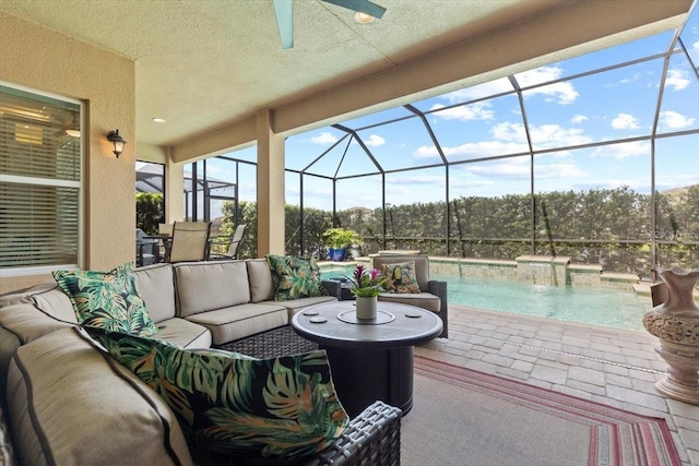view of patio with a lanai, an outdoor pool, an outdoor hangout area, and ceiling fan
