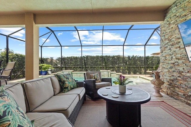 view of patio featuring an outdoor living space and a lanai
