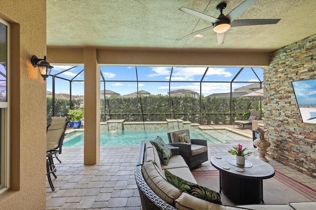 view of patio with outdoor lounge area, an outdoor pool, a ceiling fan, and a lanai