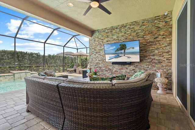 view of patio with an outdoor pool, an outdoor living space, a ceiling fan, and a lanai