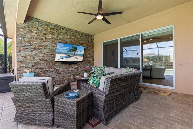 view of patio with outdoor lounge area and ceiling fan