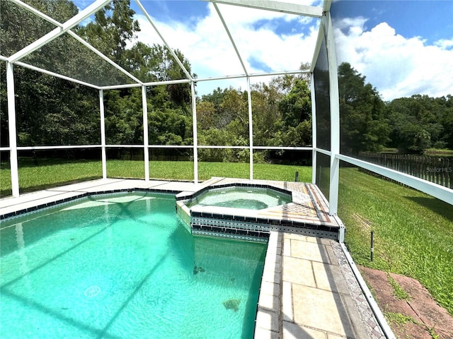 view of swimming pool with a yard, a pool with connected hot tub, and a lanai