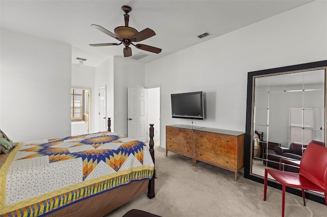 carpeted bedroom with visible vents and ceiling fan