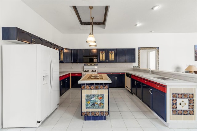kitchen with tasteful backsplash, a center island, a sink, light countertops, and white appliances