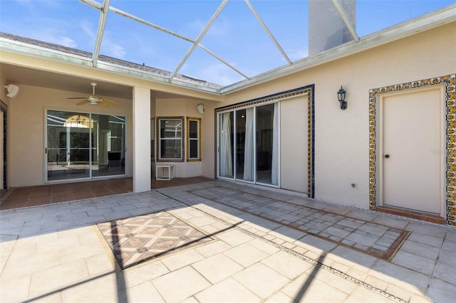 exterior space featuring a patio area, stucco siding, a lanai, and ceiling fan