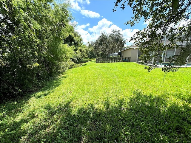 view of yard featuring fence