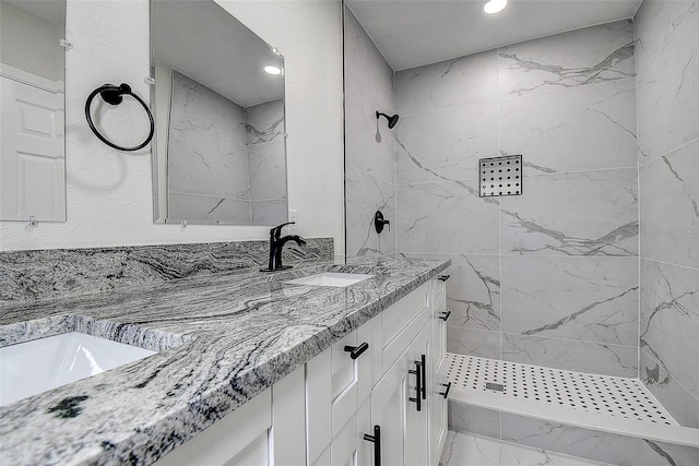 3841 Wahoo Dr SE, Saint Petersburg, FL 33705 - bathroom featuring recessed lighting, double vanity, a sink, and a marble finish shower