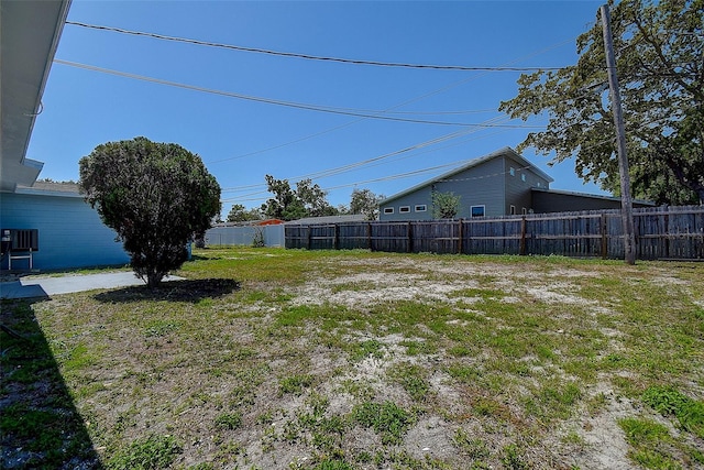 3841 Wahoo Dr SE, Saint Petersburg, FL 33705 - view of yard featuring central AC unit and fence