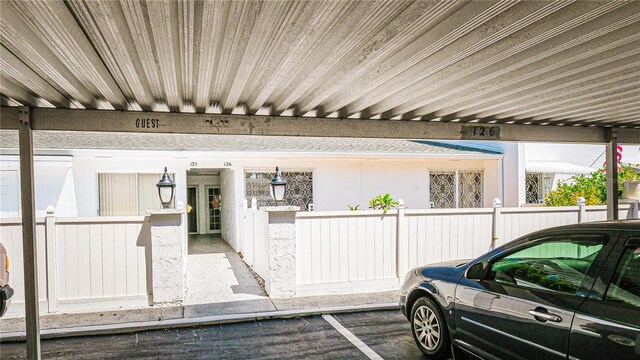 1655 S Highland Ave Unit F126, Clearwater, FL 33756 - property entrance featuring covered parking and fence