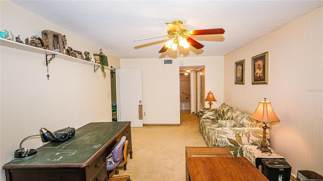 1655 S Highland Ave Unit F126, Clearwater, FL 33756 - living area featuring light carpet, visible vents, a textured ceiling, and a ceiling fan